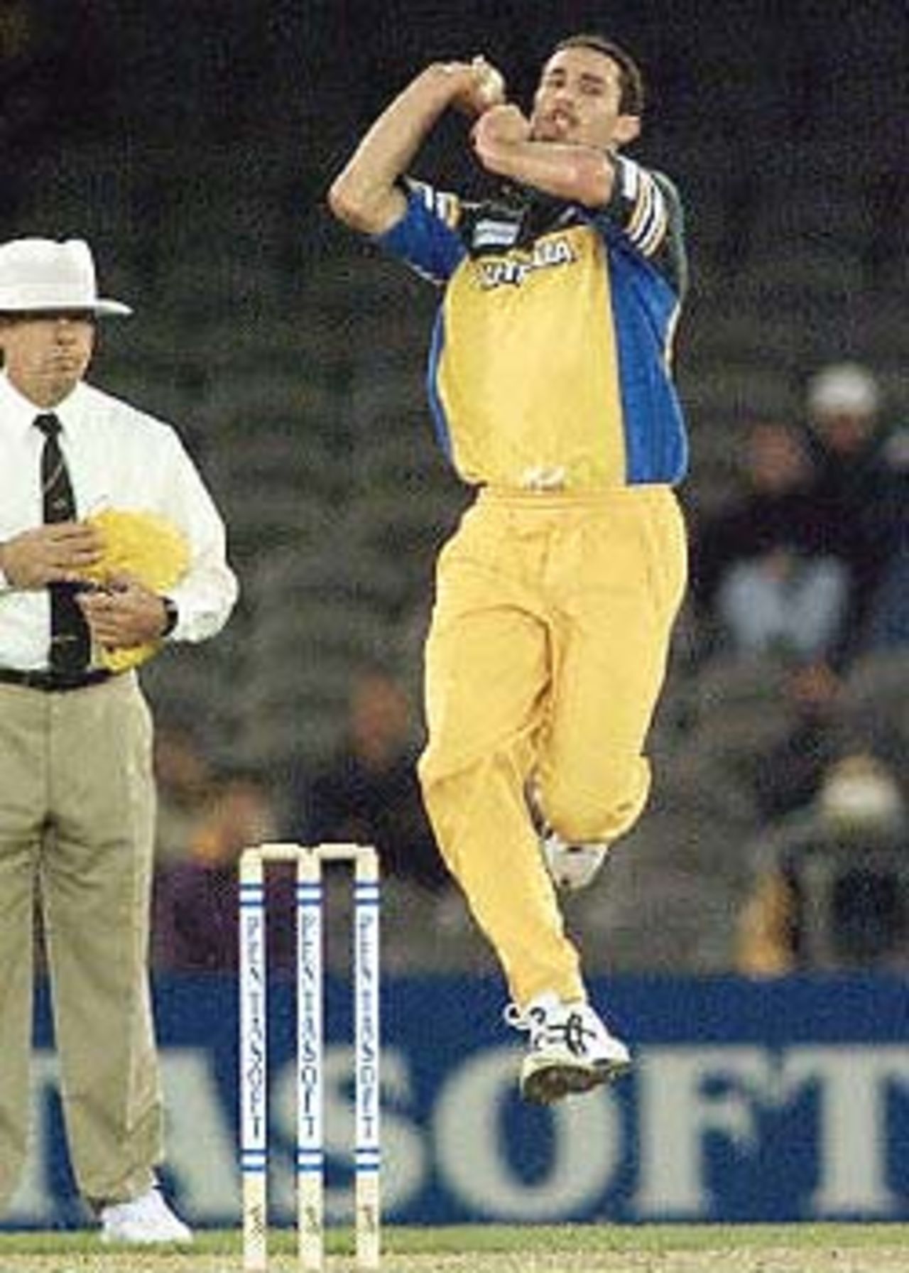 Australian paceman Jason Gillespie sends down another delivery on the way to taking three South African wickets in their one day cricket match being played under a closed roof at the Colonial Stadium in Melbourne. Being played in the middle of winter in Melbourne, South Africa scored 226-8 in their 50 overs but Australia leads the three match series 1-0. South Africa in Australia, 2000/01, 2nd One-Day International, Australia v South Africa, Colonial Stadium, Melbourne, 18 August 2000.