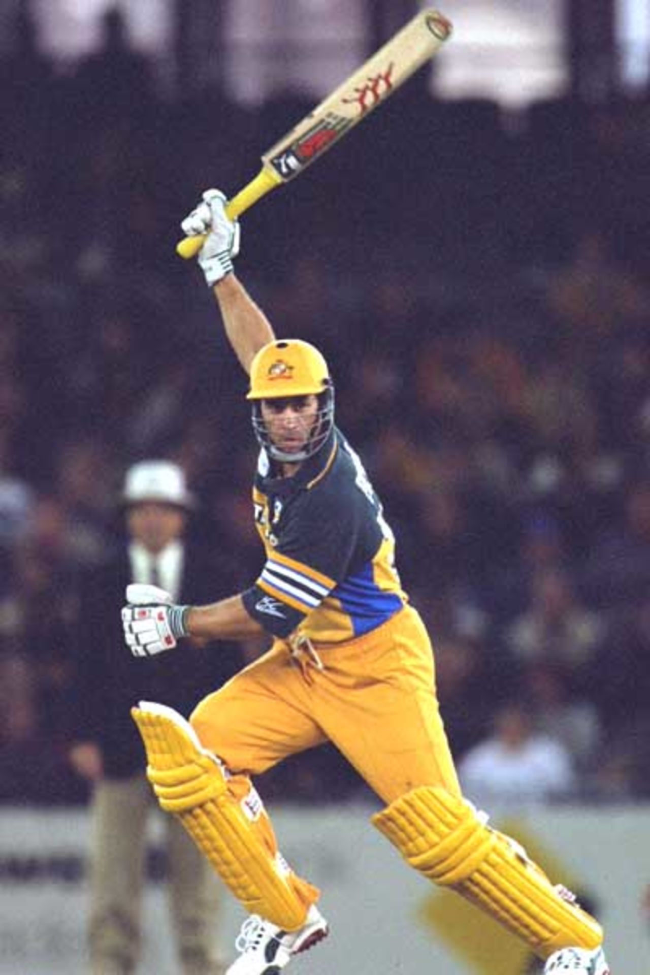 20 Aug 2000: Michael Bevan of Australia loses the handle on a drive, in the match between Australia and South Africa, in game three of the Super Challenge 2000, played at Colonial Stadium in Melbourne, Australia. South Africa defeated Australia by 8 runs.