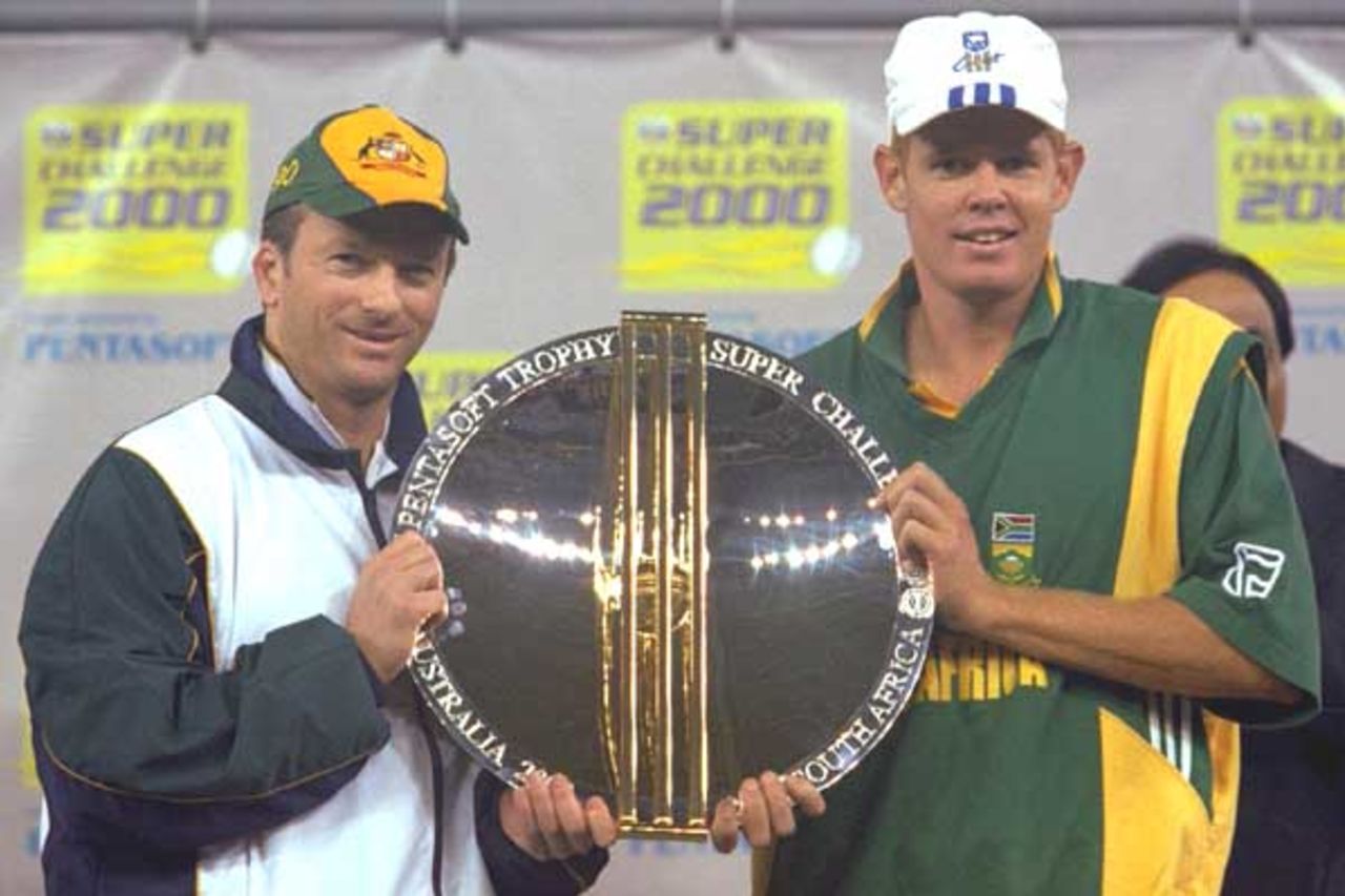20 Aug 2000: Captains, Steve Waugh of Australia and Shaun Pollock of South Africa hold the Super Challenge 2000 Trophy after the series was drawn, in the match between Australia and South Africa, in game three of the Super Challenge 2000, played at Colonial Stadium in Melbourne, Australia. South Africa defeated Australia by 8 runs.