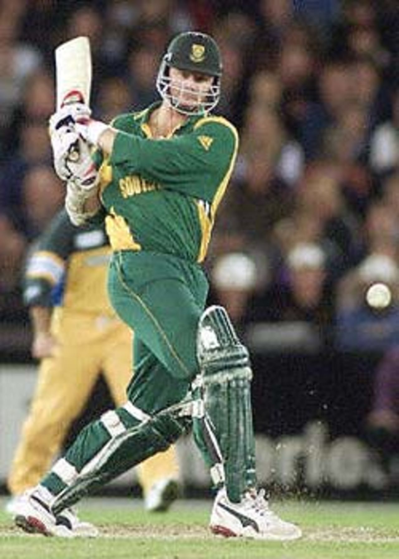 South African batsman Lance Klusener pulls a ball from an Australian bowler in their one day cricket match being played under a closed roof at the Colonial Stadium in Melbourne, 20 August 2000. Being played in the middle of winter in Melbourne, South Africa scored 206-7 from their 50 overs after being in deep trouble at 19-4. South Africa in Australia, 2000/01, 3rd One-Day International, Australia v South Africa, Colonial Stadium, Melbourne, 20 August 2000.