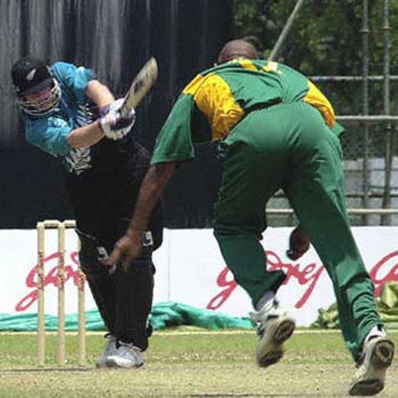 New Zealander Scott Styris drives on the onside during the Singapore Challenge 2000 cricket triangular in Singapore. South Africa made its way into a prime position as it dismissed New Zealand for 158. Godrej Singapore Challenge, 2000/01, 3rd Match, New Zealand v South Africa, Kallang Ground, Singapore 25 August 2000.