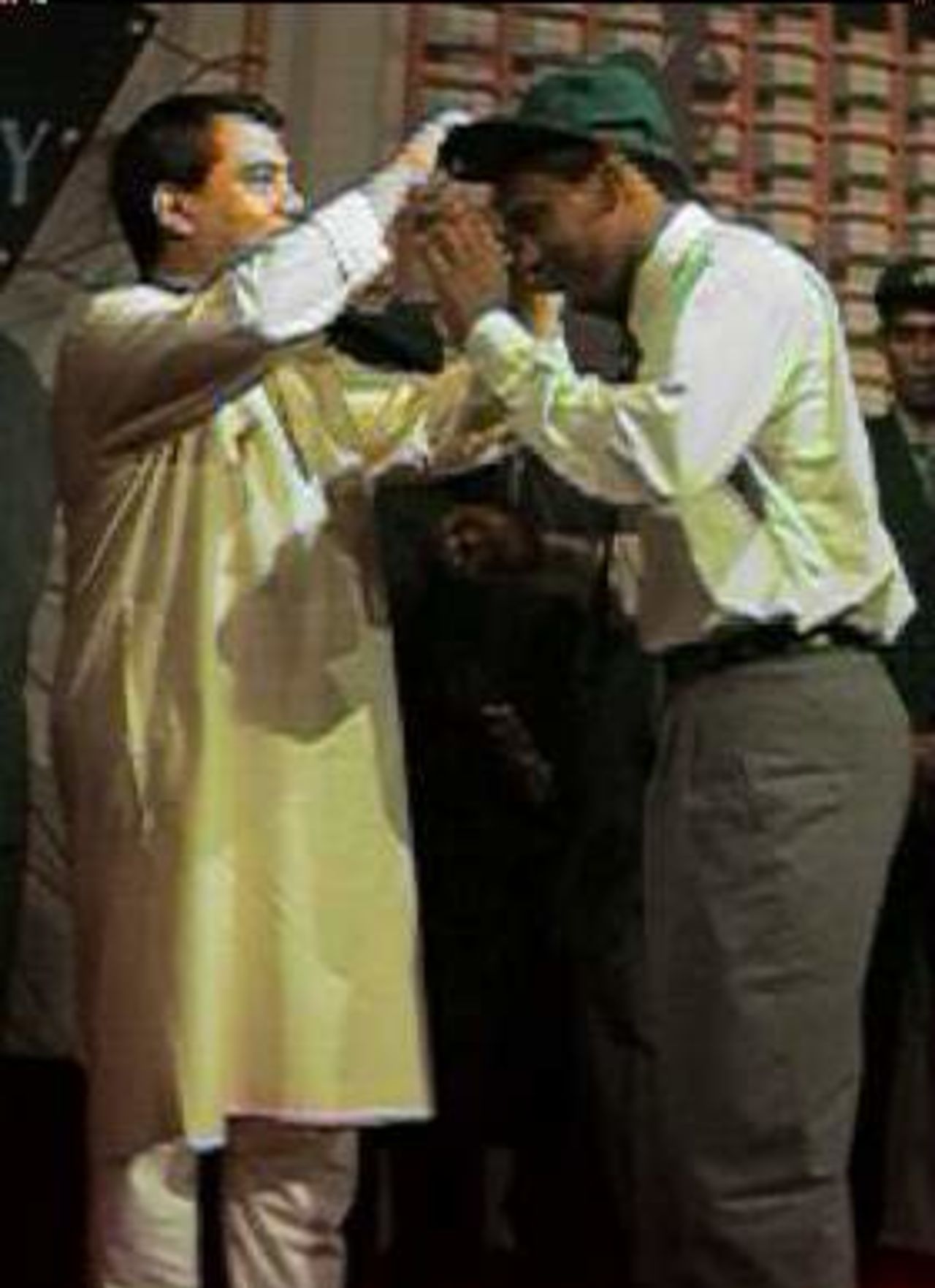Habibul is receiving his Test Cap from BCB President
