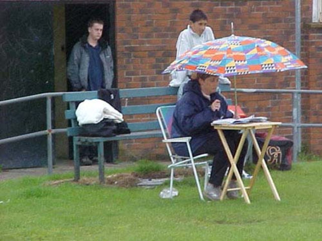 Haslingden Methodists scorer Ann Devoy shelters from the rain
