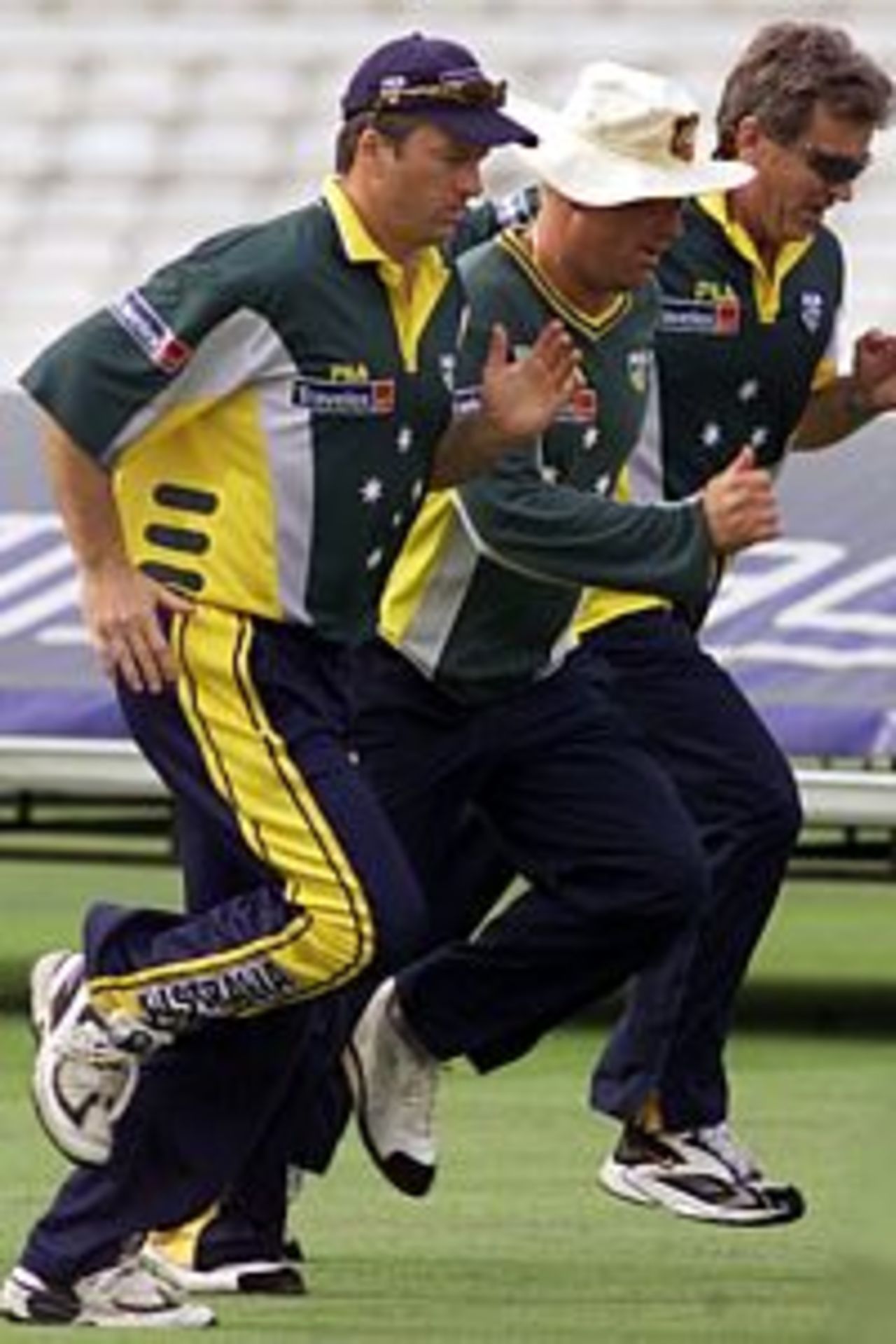 23 Aug 2001: Steve Waugh of Australia attempts to proves his fitness, with team mate Shane Warne and Physio Errol Alcott before play, during day on of the Fifth Test between England and Australia, at The Oval, London, England.