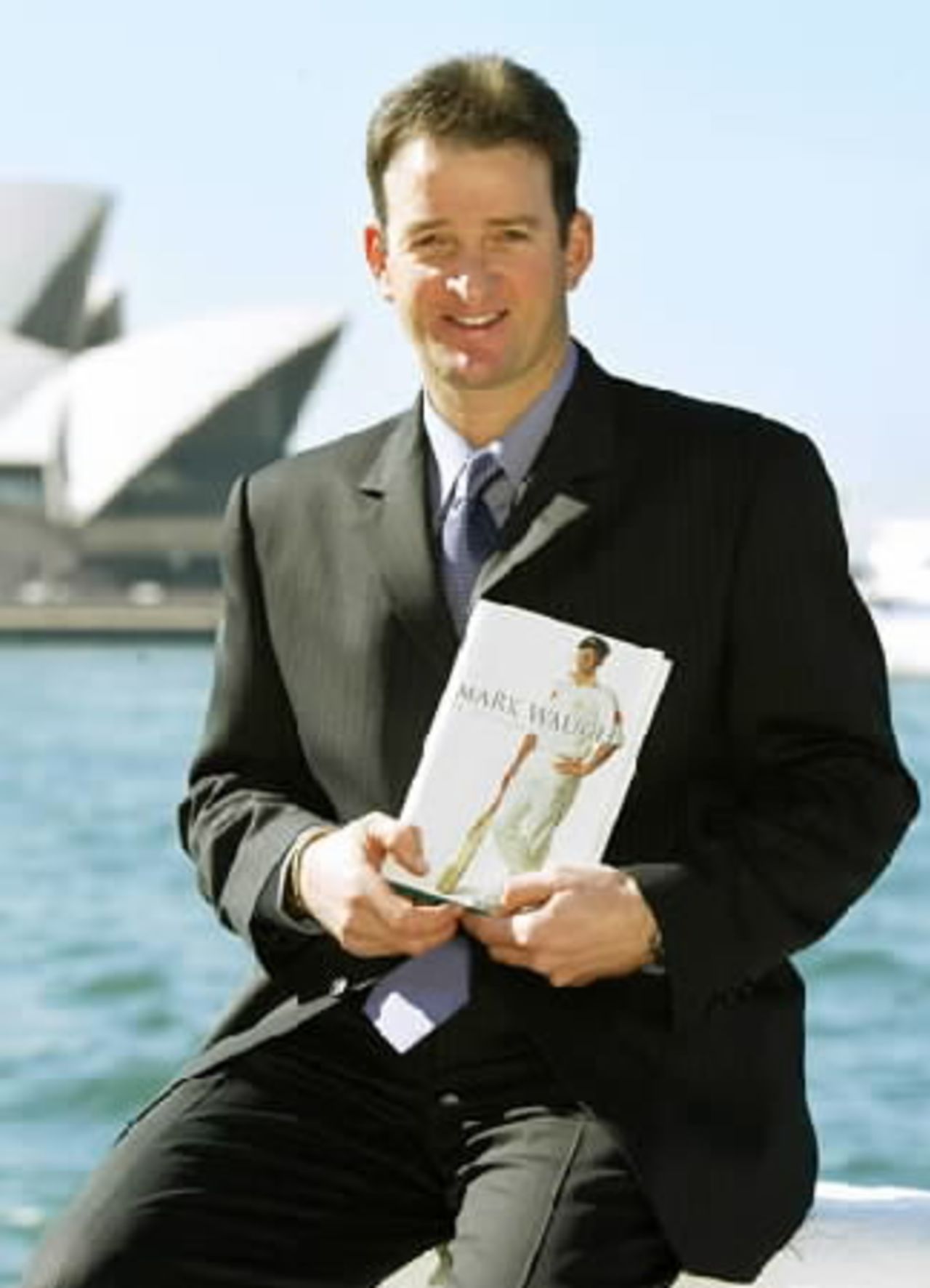 Australian cricketer Mark Waugh holds a copy his autobiography in Sydney where he declared his career was far from over August 1, 2002. Waugh, a veteran of 125 tests and 244 one-day internationals, said he almost quit cricket during the Indian bookmaker affair and was disappointed at what he called a lack of support from the Australian Cricket Board.