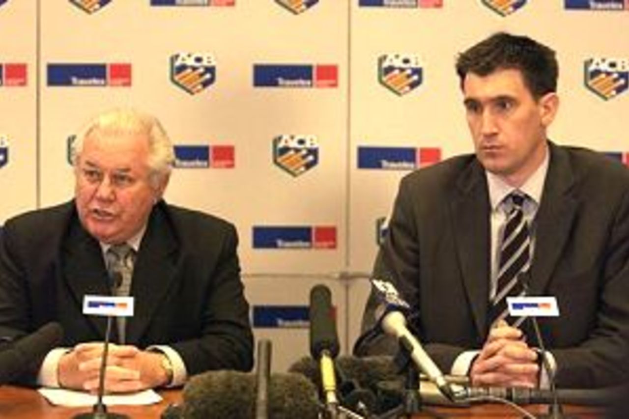 MELBOURNE - AUGUST 9: Bob Merriman chairman of the ACB and James Sutherland CEO of the ACB talk to the media during the ACB press conference to announce that due to serious concerns about security and safety in Pakistan Australia will not be touring to Pakistan for the upcoming test series. The press conference was held at ACB headquarters,Melbourne, Australia on 9 August, 2002.