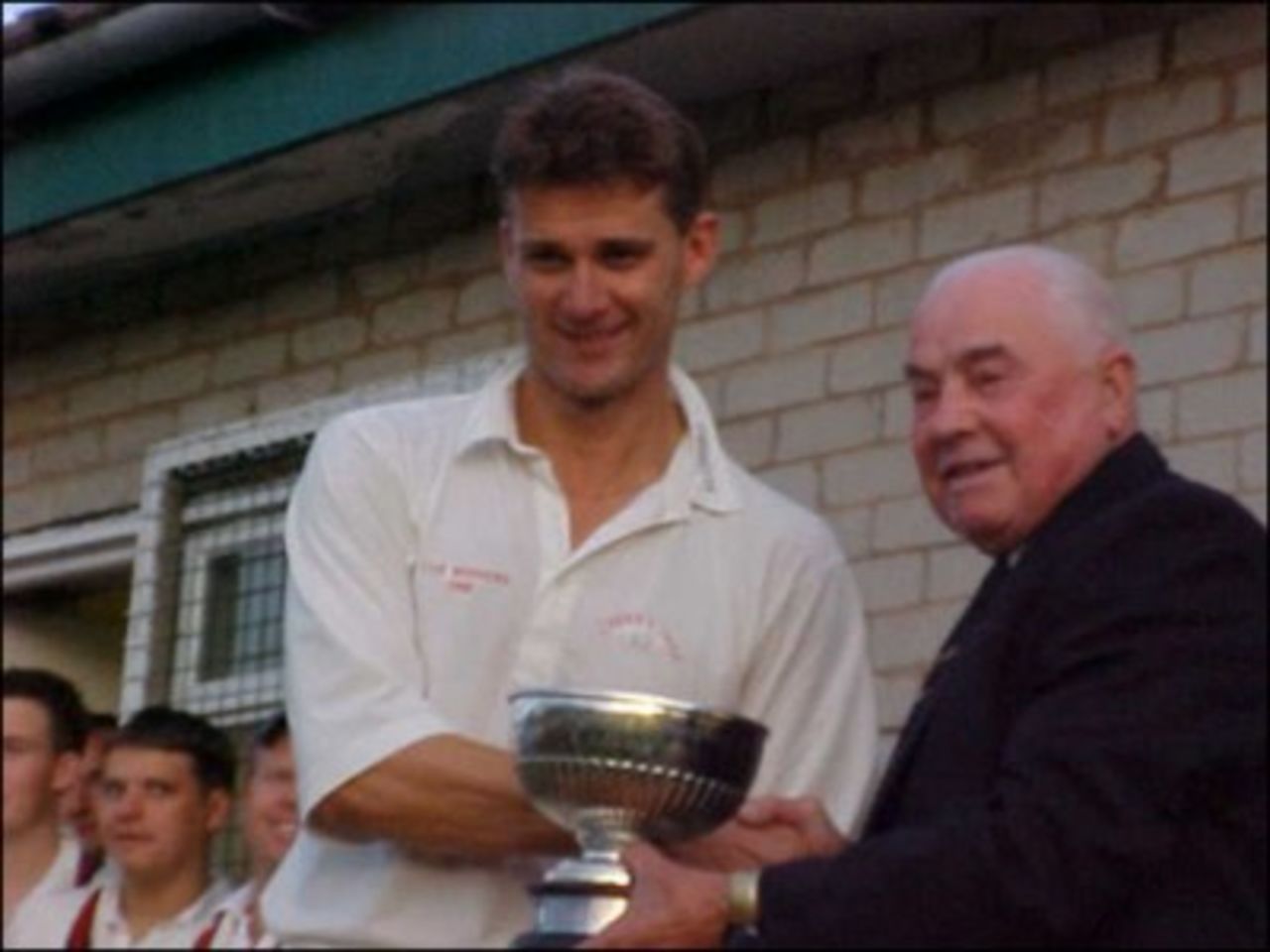 Ramsbottom Cup 2002 - Cherry Tree captain Mark Butler receives the Cup from League President Arthur Shaw