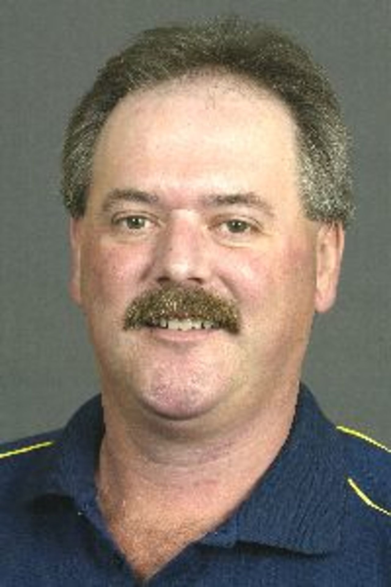 Portrait of Bruce Bennett, umpire, August 2002