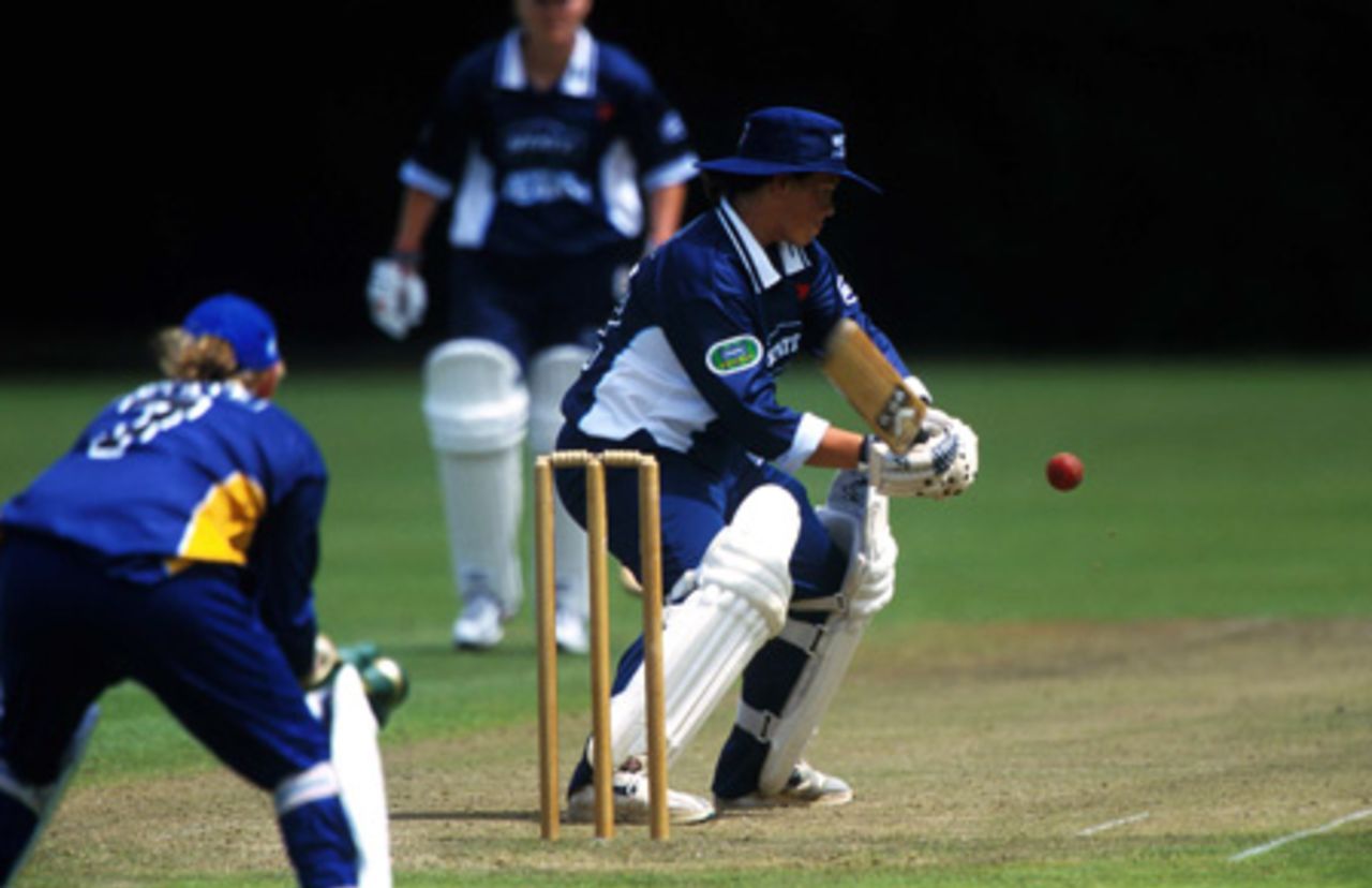 Auckland women's player Emily Drumm steers a delivery down to third man during her innings of 78. State League: Auckland Women v Otago Women at Melville Park, Auckland, 15 January 2002.
