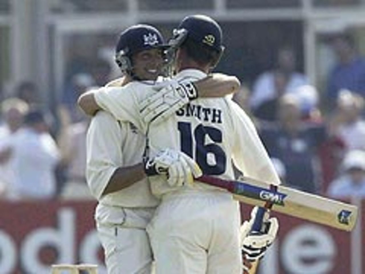 James Averis and Mike Smith celebrate Gloucestershire's one-wicket victory over Derbyshire at Bristol