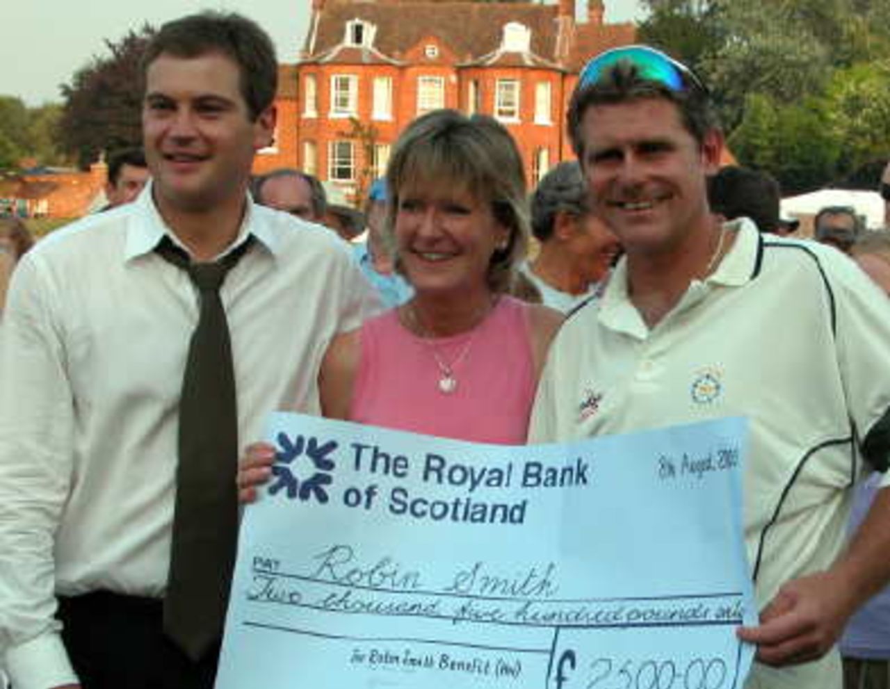 Robin Smith receives cheque from Sponsors of the event, Anthony Mowatt of Keystone Legal Benefits and Jane Fogg of G L Hearn.