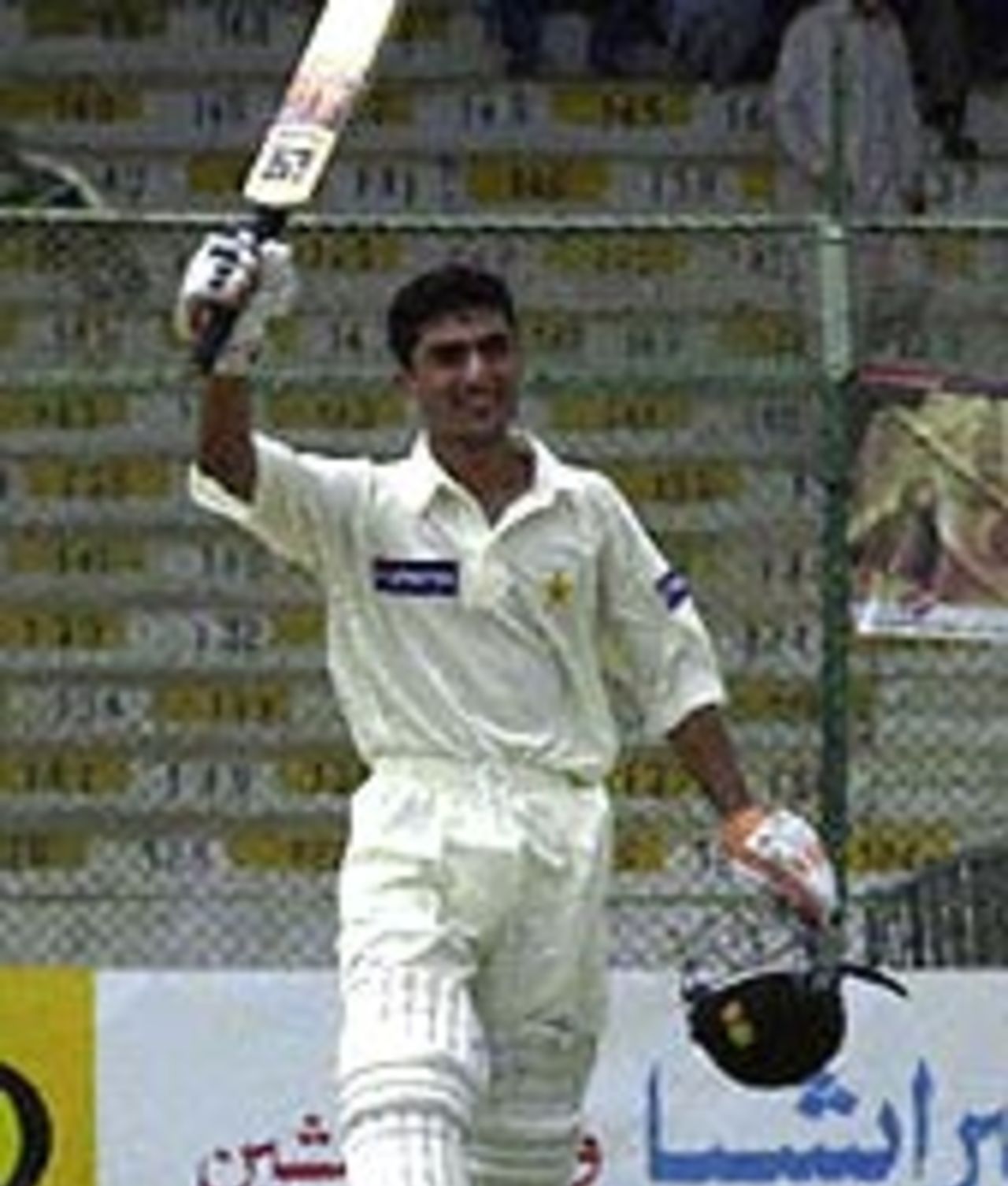 Yasir Hameed acknowledges the crowd after scoring a century on debut against Bangladesh at Karachi