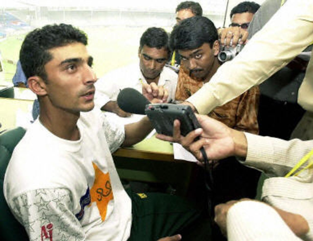 Yasir Hameed (L) speaking to the media after his debut 170, at the end of the second day of the first Test aganist Bangladesh, 21 August 2003.