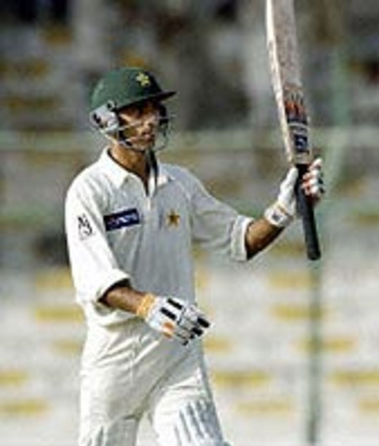 Yasir Hameed acknowledges the crowd after scoring a century in the second innings against Bangladesh at Karachi