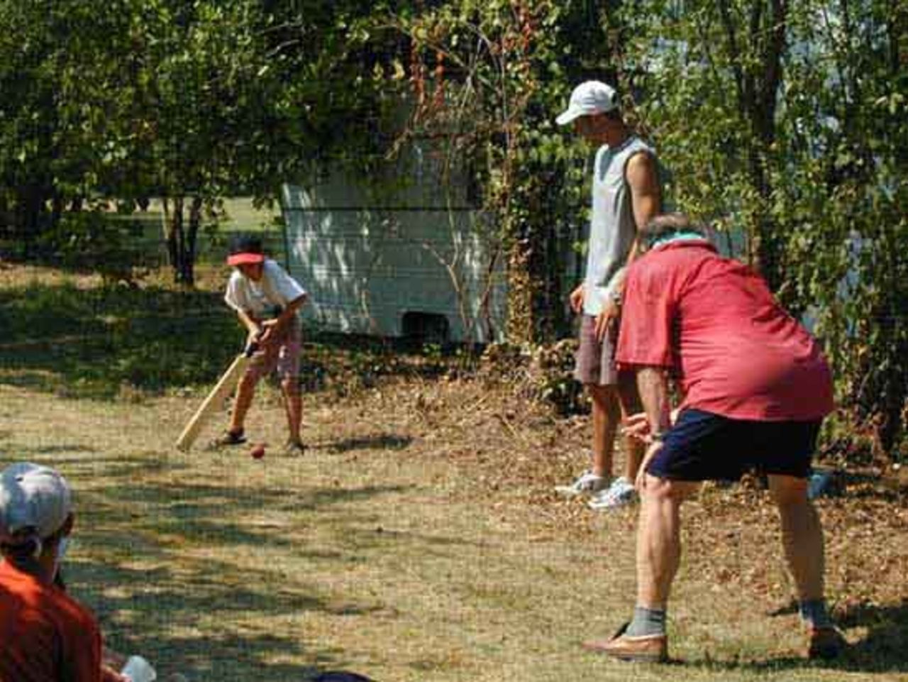 One of the kids from the local school gets a chance to handle the bat. They had loads of fun!