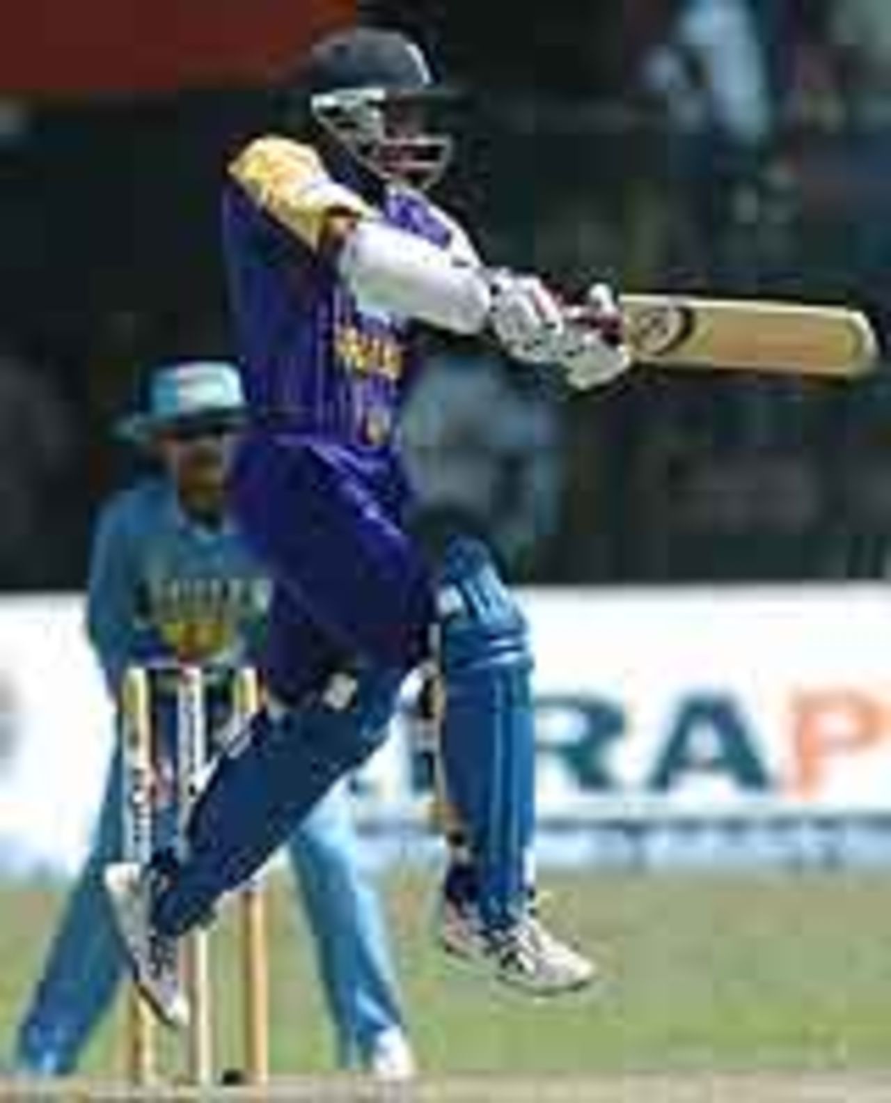 An airborne Sanath Jayasuriya cuts viciously, Sri Lanka v India, Final, Asia Cup, August 1, 2004