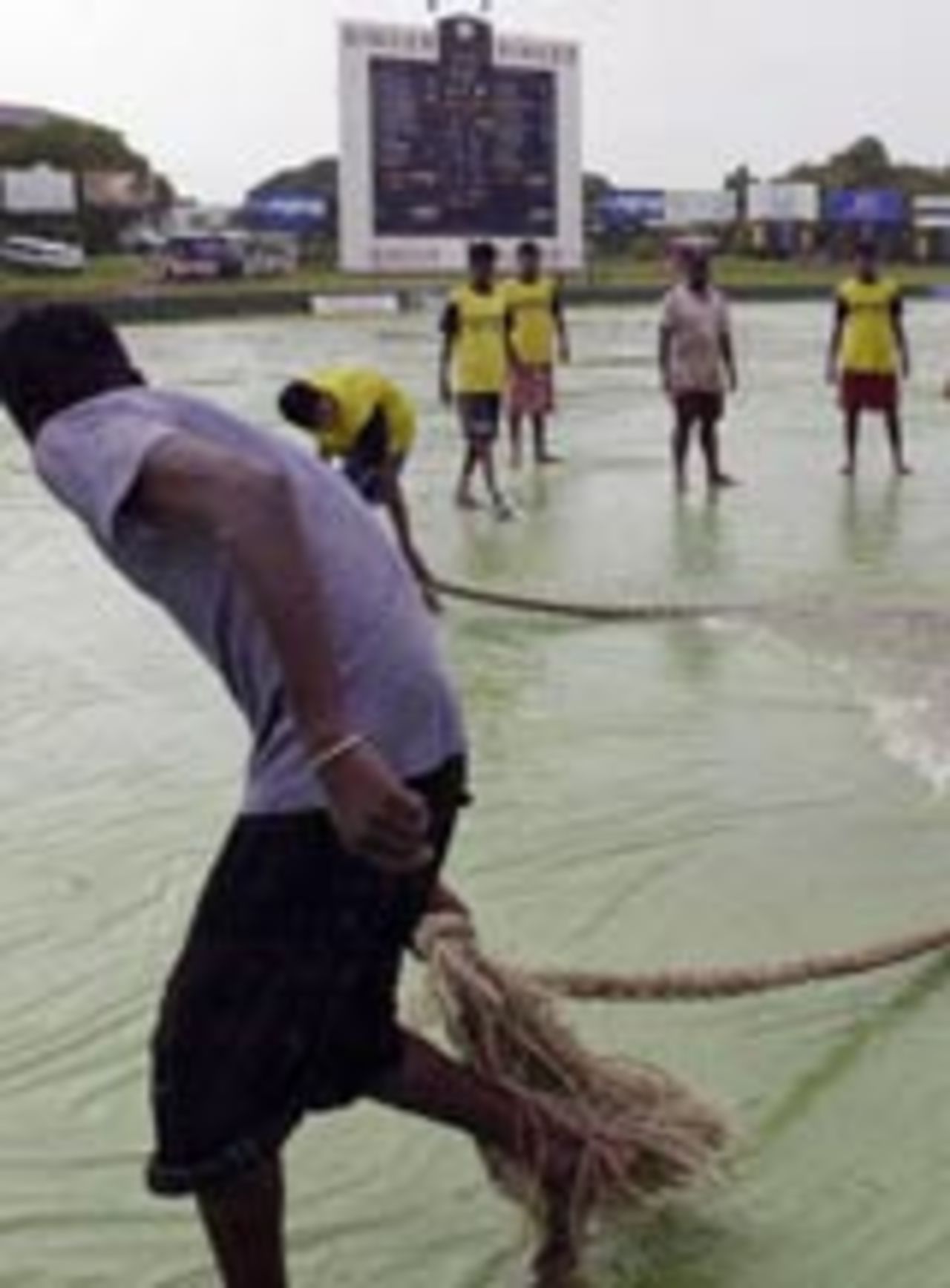Groundsmen at work at a water-logged SSC Stadium, Sri Lanka v South Africa, 2nd Test, 4th day, Colombo, August 14, 2004