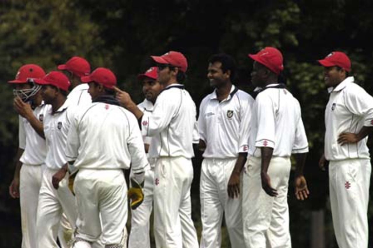 Canadian Team - all smiles as another Bermudian wicket falls.