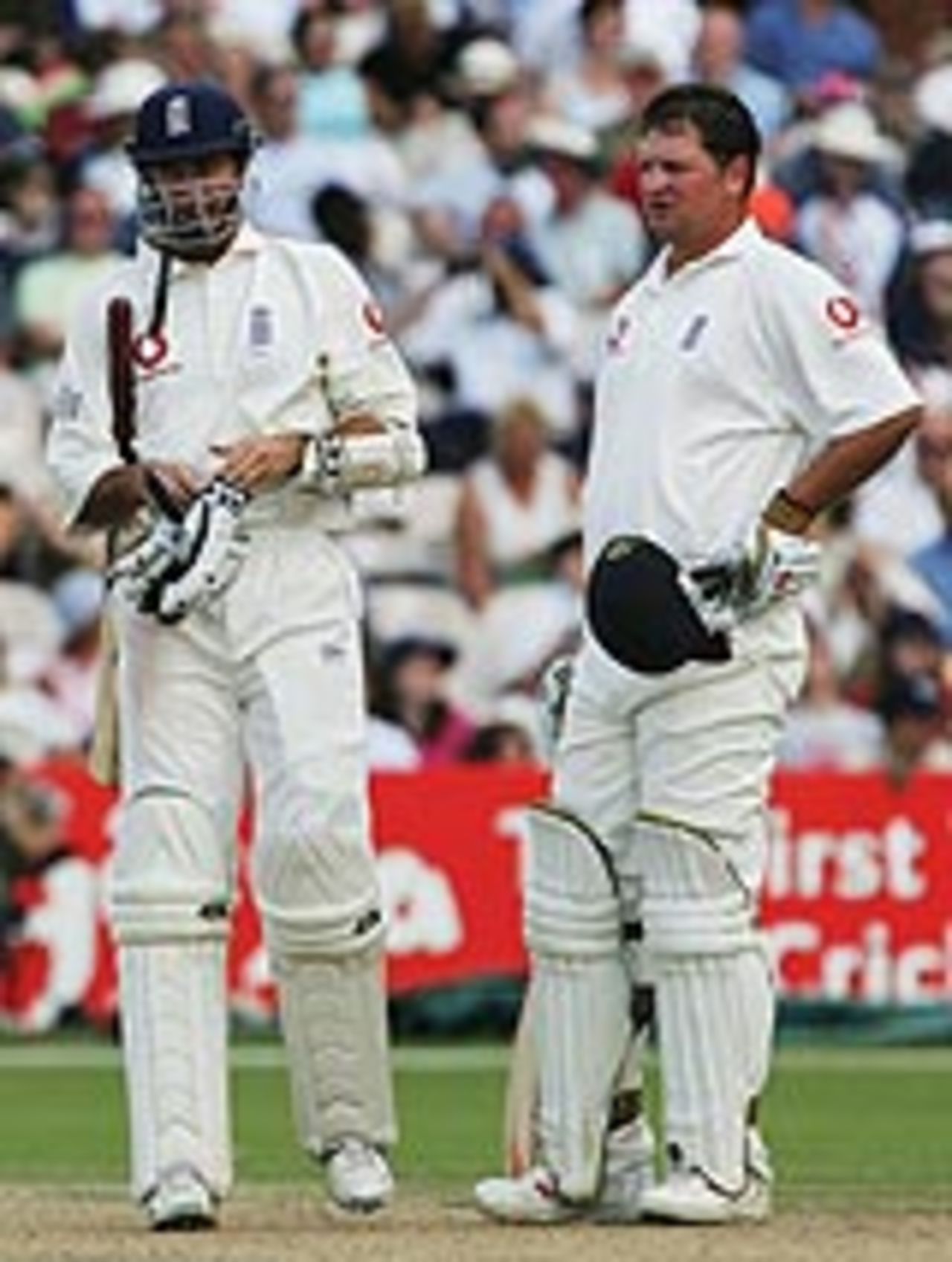 Robert Key and Michael Vaughan pause for breath, as England chase 231 for victory at Old Trafford