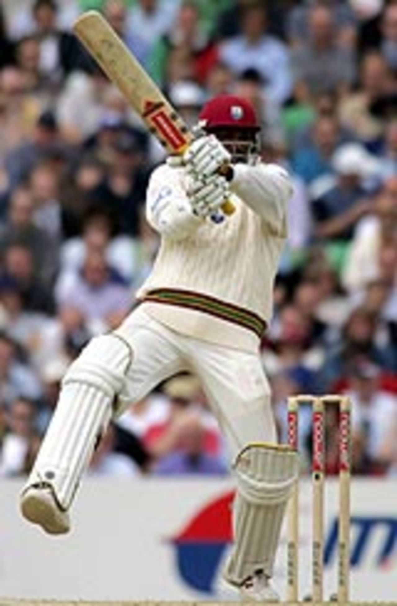 Chris Gayle smacks a six, on the way to his 80-ball century on the third morning at The Oval
