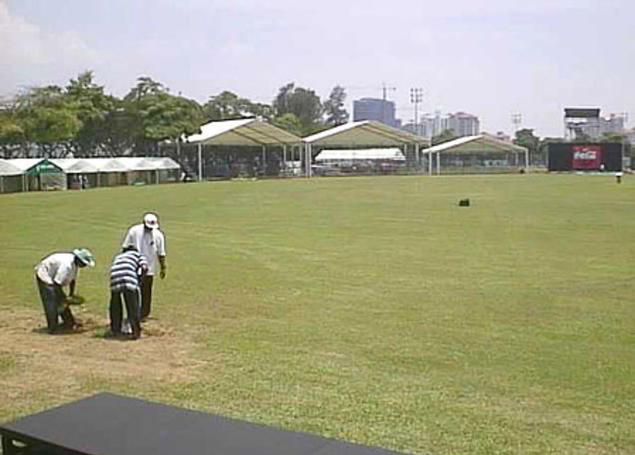 Groundsmen at work on the Kallang ground