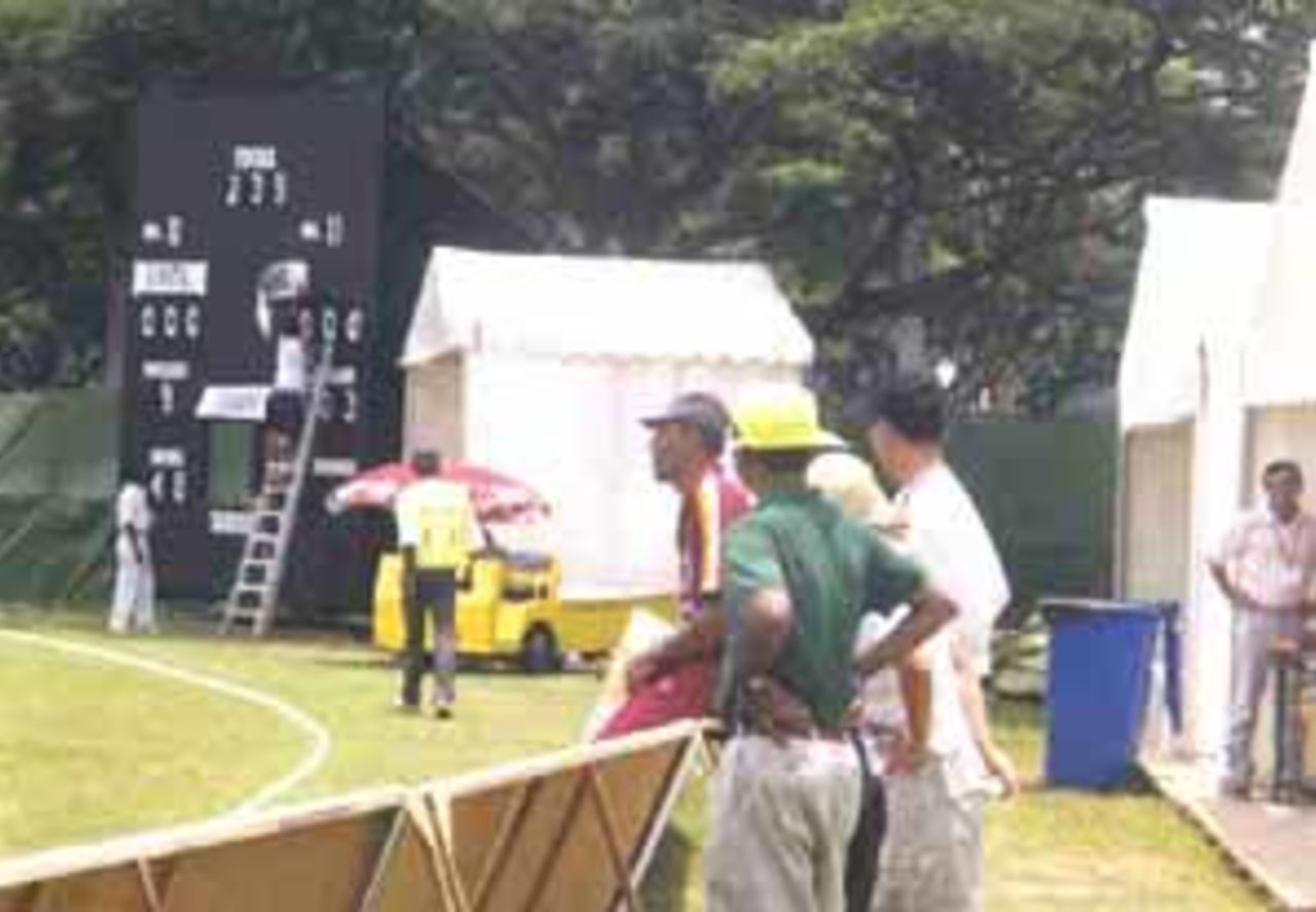 Merv Dillon taking a break just before the conclusion of the Zimbabwe innings, 1st Match, Coca-Cola Singapore Challenge, 1999-2000, Kallang Ground, Singapore, 2 Sep 1999.