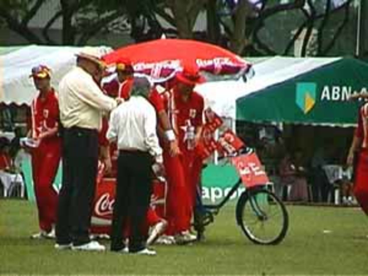 A welcome drinks break to the Zimbabweans amidst Indian run riot, India v Zimbabwe (2nd ODI), Coca-Cola Singapore Challenge, 1999-2000, Kallang Ground, Singapore, 4 Sep 1999.