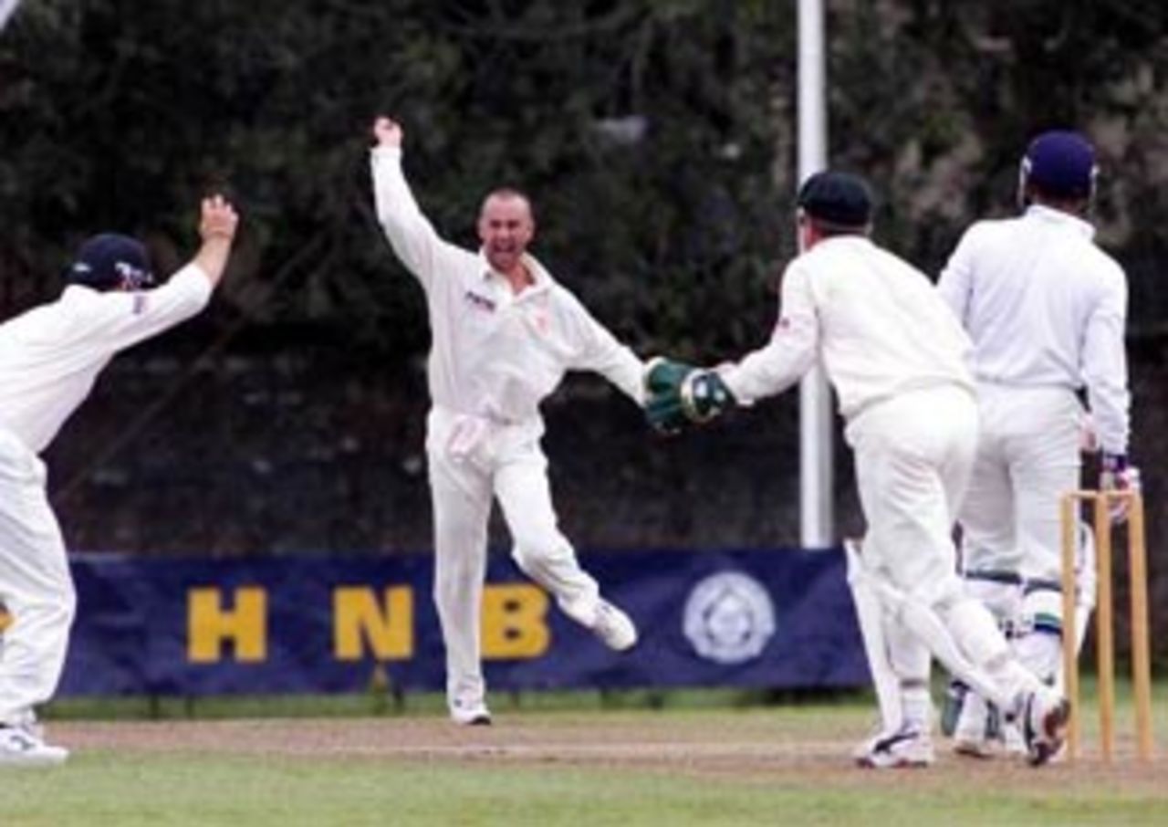 4 Sep 1999: Justin Langer (left) of Australia claims a catch off Prasanna Jaywardene of the Board XI as bowler Colin Miller and wicketkeeper Ian Healy start to celebrate, however the catch was controversially given not out, during day two of the