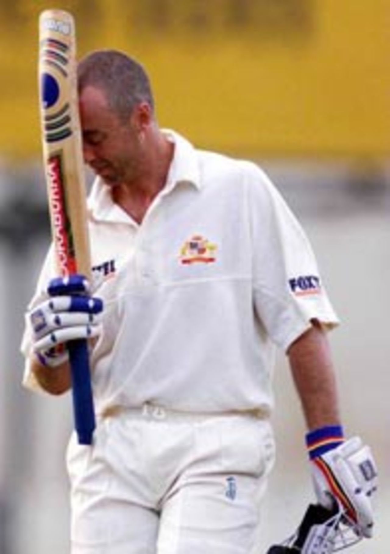 4 Sep 1999: A dejected Colin Miller of Australia leaves the ground after being dismissed, during day two of the tour match between the Sri Lanka Board XI and Australia at Saravanamuttu Stadium, Colombo, Sri Lanka.