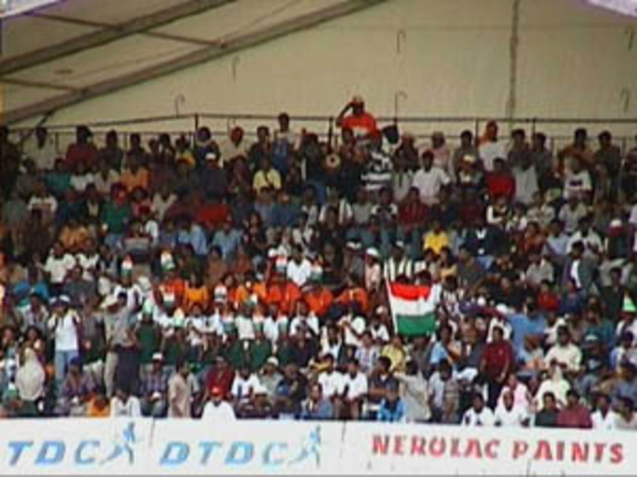 A section of the Indian supporters, waving the tri-colour flag, India v Zimbabwe (2nd ODI), Coca-Cola Singapore Challenge, 1999-2000, Kallang Ground, Singapore, 4 Sep 1999