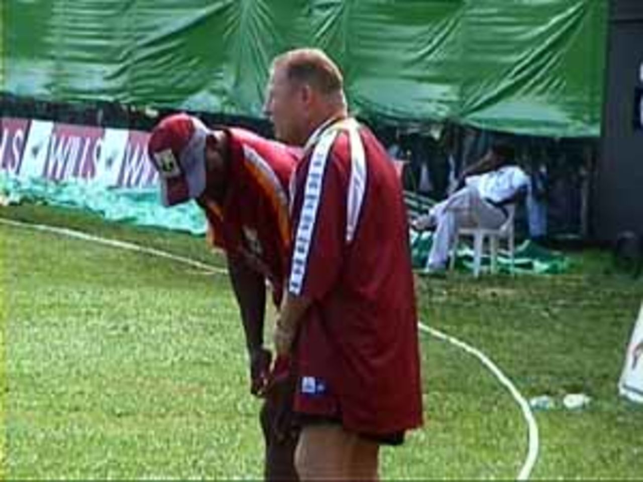 West Indian physio Dennis Waight waits anxiously at the boundary line, India v West Indies (3rd ODI), Coca-Cola Singapore Challenge, 1999-2000, Kallang Ground, Singapore, 5 Sep 1999.