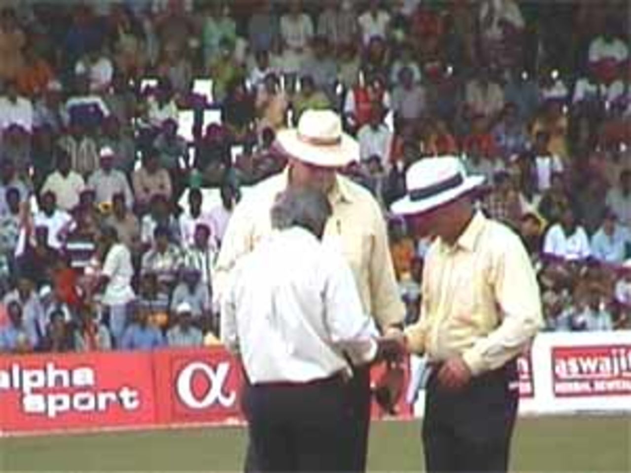 Umpires take a close look at the white ball that has become dirty, India v West Indies (Final), Coca-Cola Singapore Challenge, 1999-2000, Kallang Ground, Singapore, 7 Sep 1999.