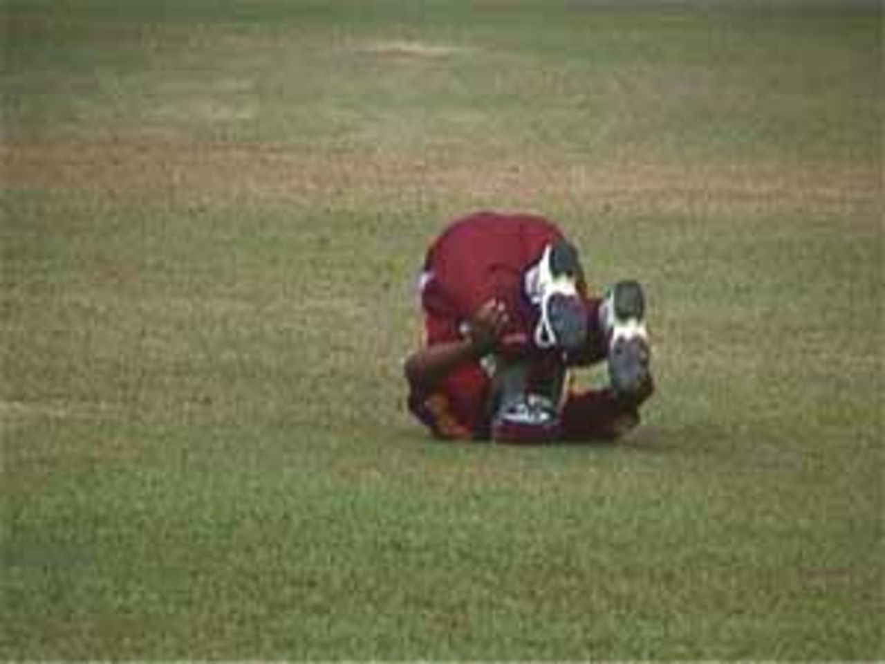 Lara stretching on the ground during the drinks interval, India v West Indies (Final), Coca-Cola Singapore Challenge, 1999-2000, Kallang Ground, Singapore, 7 Sep 1999.
