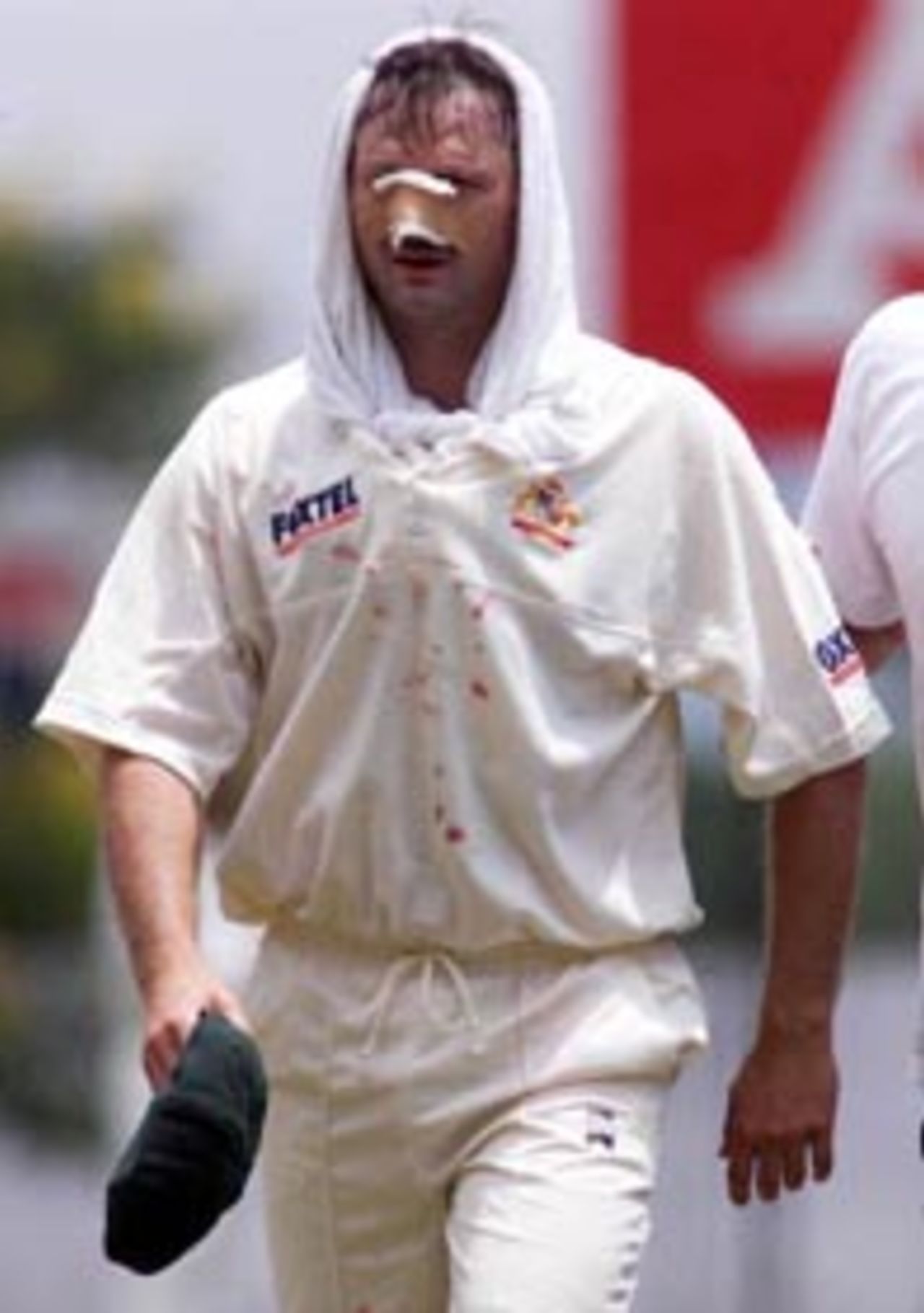 10 Sep 1999: Steve Waugh leaves the field bleeding after Jason Gillespie and Steve Waugh of Australia collided attempting a catch, during day two of the First Test between Sri Lanka and Australia at Asgiriya Stadium, Kandy, Sri Lanka.