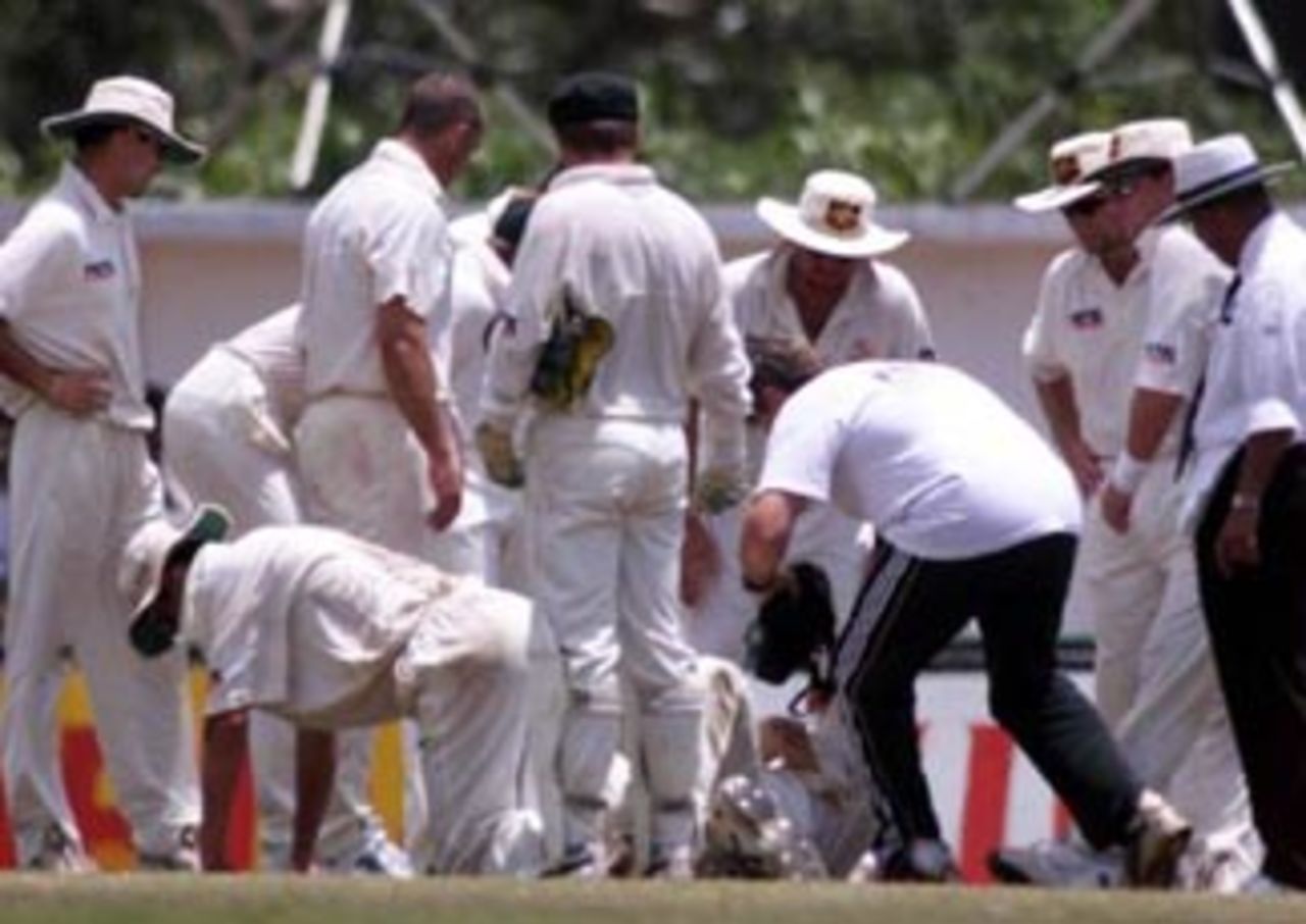 10 Sep 1999: The Australian tean crowd around after Jason Gillespie and Steve Waugh of Australia collided attempting a catch, during day two of the First Test between Sri Lanka and Australia at Asgiriya Stadium, Kandy, Sri Lanka.