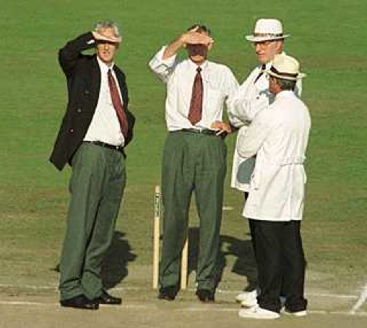 Club officials Dave Edmundson and Jim Cumbes with Umpires Nigel Plews and John Steele in the shining Old Trafford, County Championship, Lancashire v Kent, 8-11 September 1999