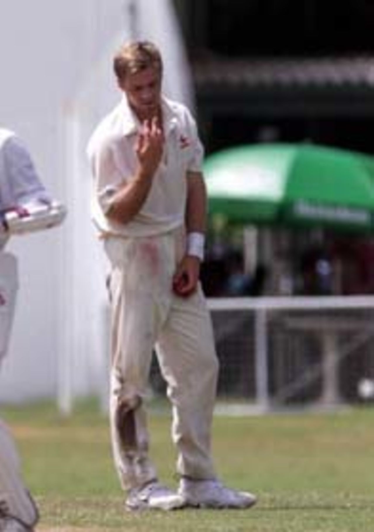 19 Sep 1999: Scott Muller of Australia, inspects his hand after splitting the webbing in his fingers, during day three of the Tour match between the Sri Lanka Board XI and Australia at Colombo Cricket Club, Colombo, Sri Lanka.