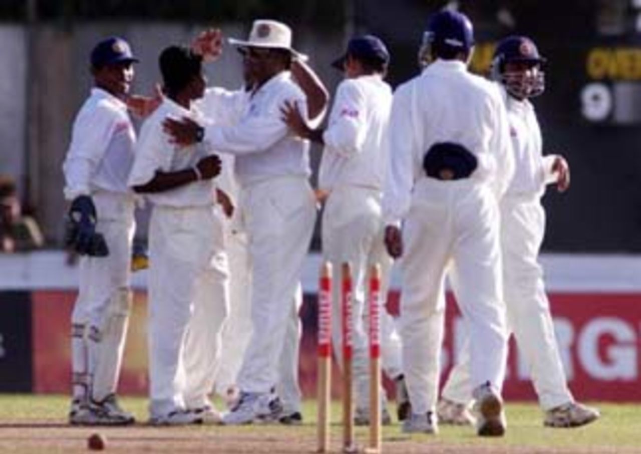 24 Sep 1999: Herath of Sri Lanka is congratulated by team mates after bowling Damien Fleming of Australia, during day three of the second test between Sri Lanka and Australia at Galle International Stadium, Galle, Sri Lanka.