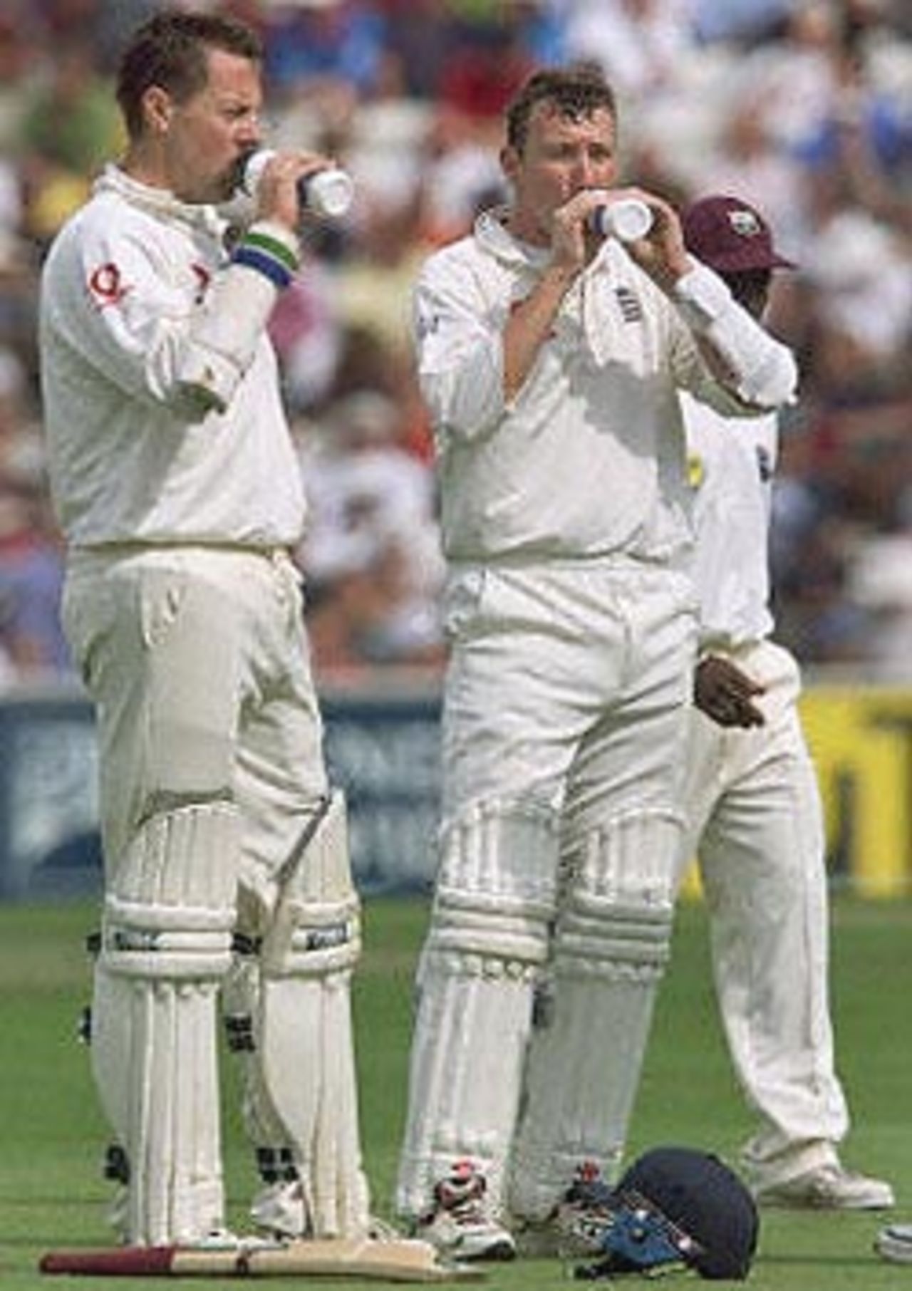 England's opening batsmen Marcus Trescothick (L) and Michael Atherton (R), take a water break during the first session of the Fifth Test against The West Indies at The Oval in London. England tour Pakistan later in the year and will have to leave the field for refreshements because of Ramadan. The Wisden Trophy, 2000, 5th Test, England v West Indies, Kennington Oval, London, 31Aug-04Sep 2000 (Day 1)