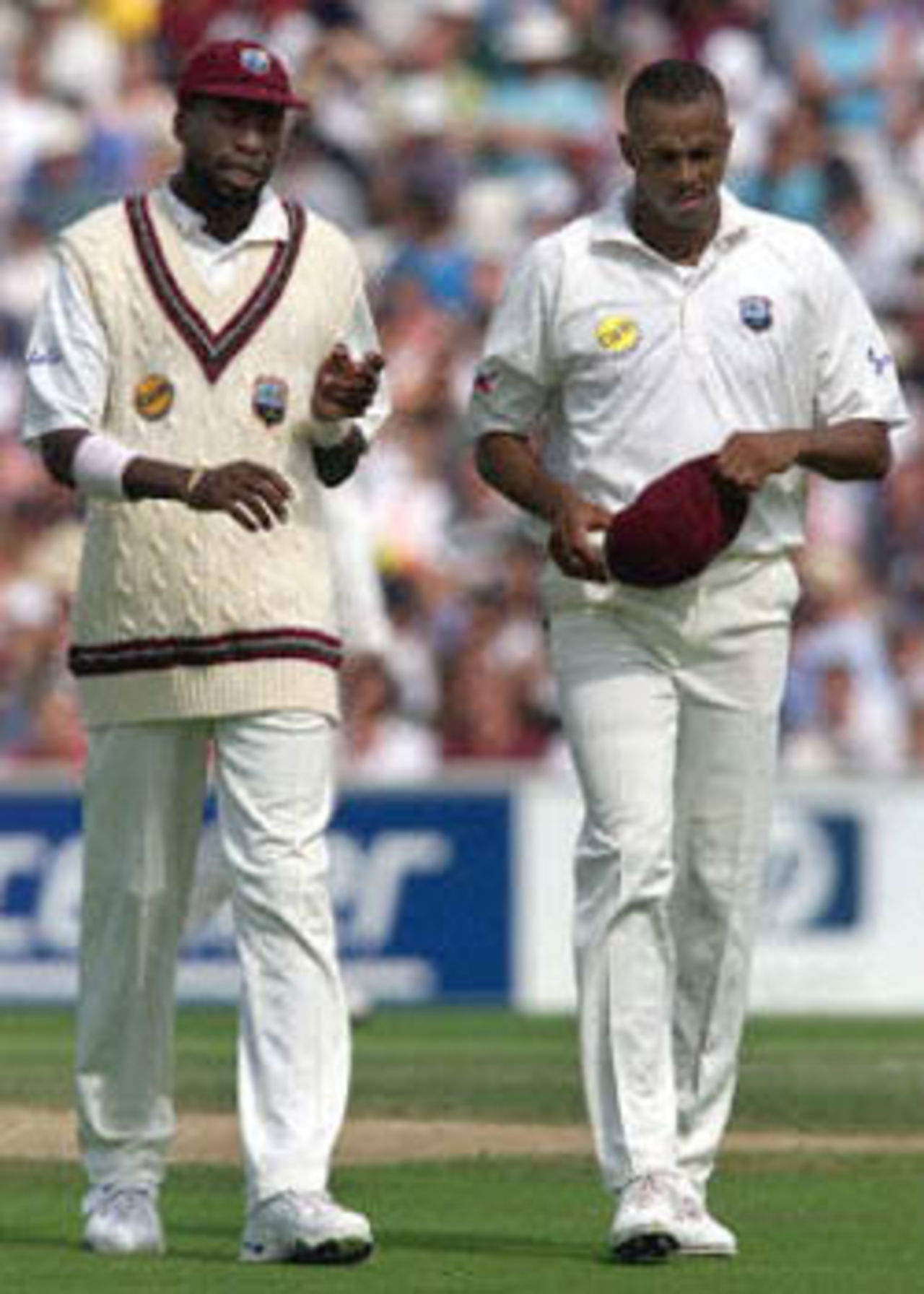 Curtly Ambrose (L) and Courtney Walsh (R), of the West Indies, walk together during the first session of the Fifth Test against England at The Oval in London. Both bowlers have taken over 400 Test wickets each and Ambrose has said he will retire from international cricket after this match. The Wisden Trophy, 2000, 5th Test, England v West Indies, Kennington Oval, London, 31Aug-04Sep 2000 (Day 1)