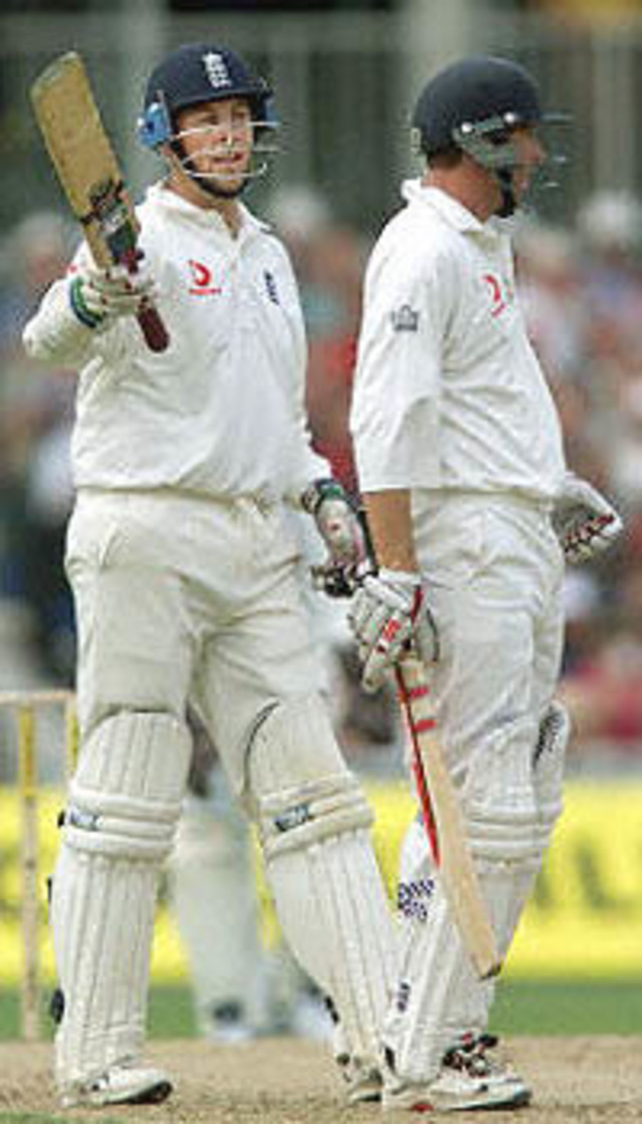 England's opening batsman Marcus Trescothick (L) holds his bat up after reaching his 50 next to Mike Atherton (R) during the Fifth Test against the West Indies at the Oval in London. Trescothick was later caught by Campbell of Nagamootoo's bowling for 78. The Wisden Trophy, 2000, 5th Test, England v West Indies, Kennington Oval, London, 31Aug-04Sep 2000 (Day 1)