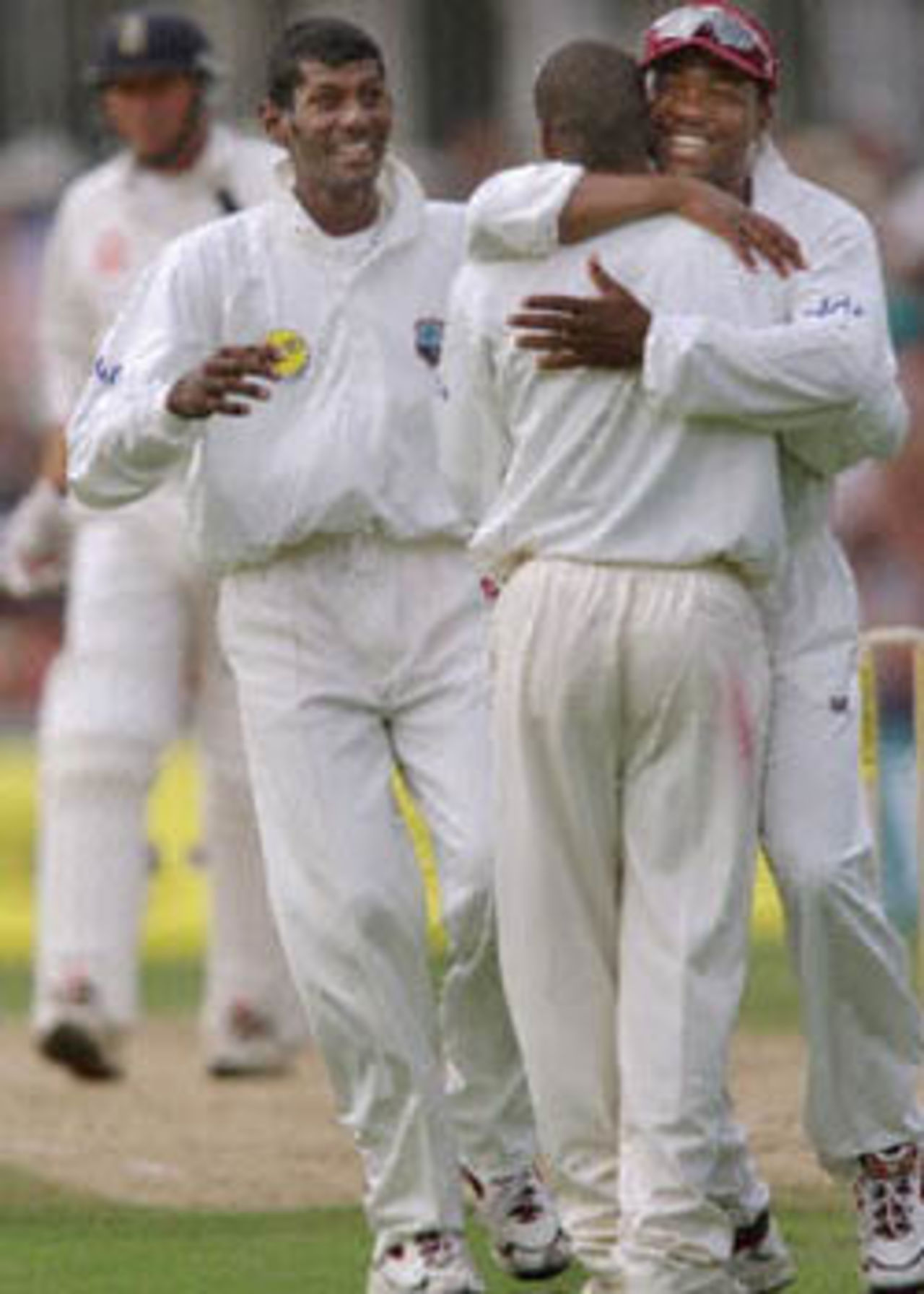 West Indies players Mahendra Nagamootoo (L), Sherwin Campbell (C) and Brian Lara (R) celebrate the fall of Marcus Trescothick's wicket during Fifth Test against England at the Oval in London. Nagamootoo, playing on his debut, claimed the first two wickets.