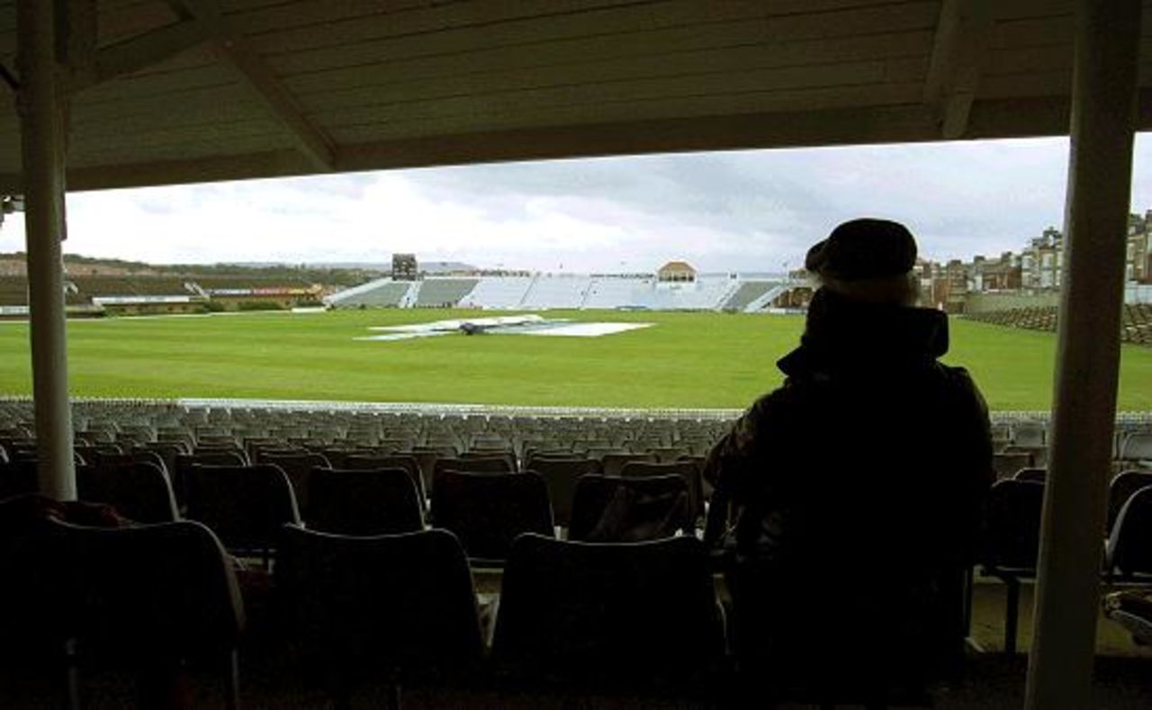 2 Sep 2000: A lone spectator waits for play to begin on the final day of the PPP Healthcare County Championship match between Yorkshire and Surrey at Scarborough.