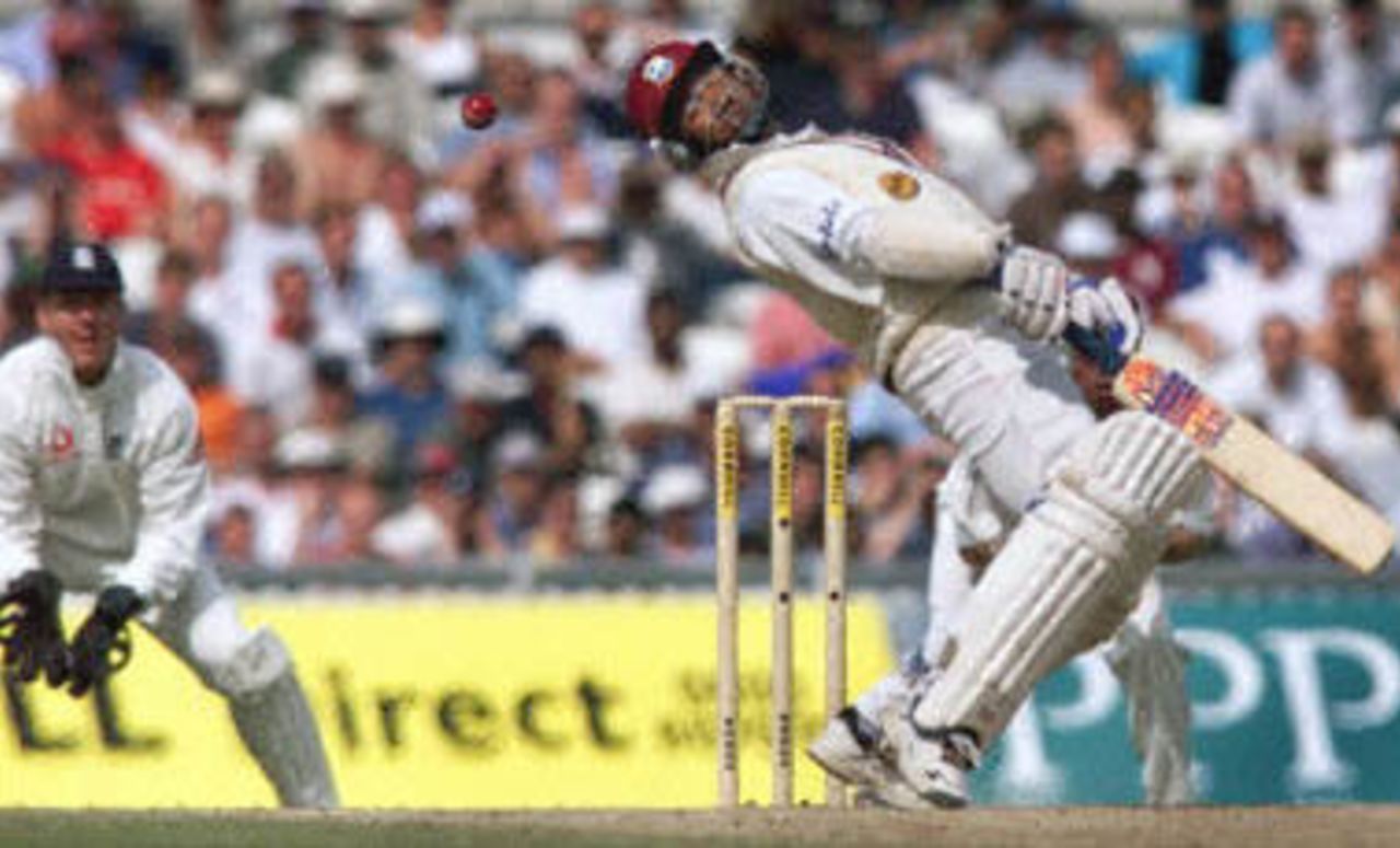 Brian Lara (R) ducks out of the way of a bouncer from Dominic Cork (not pictured) during the Test Match against England at the Oval in London. The West Indies are chasing a total 374 runs to win the match. The Wisden Trophy, 2000, 5th Test, England v West Indies, Kennington Oval, London, 31Aug-04Sep 2000 (Day 5).