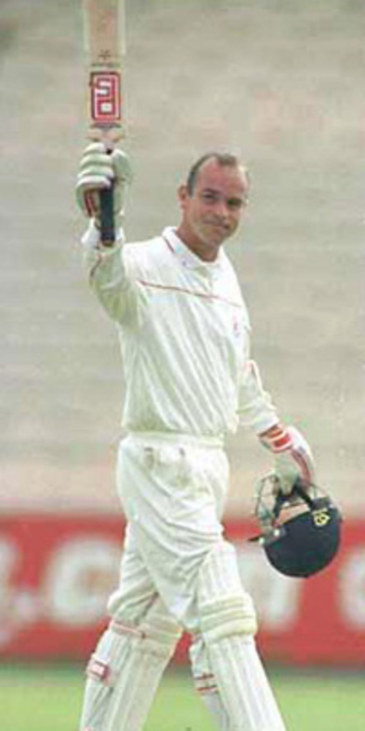 Graham Lloyd raises his bat after scoring century, PPP healthcare County Championship Division One, 2000, Lancashire v Somerset, Old Trafford, Manchester, 08-10 September 2000 (Day 2).