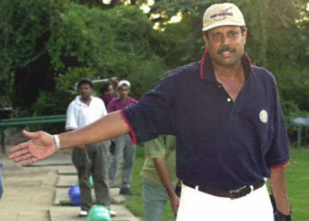 Indian cricketing legend Kapil Dev tries to prevent photographers from shooting him at a golf club in New Delhi after he resigned as the Indian cricket team coach 12 September 2000. Dev, who is in the centre of a match-fixing and corruption probe, had earlier said 'he is clean, but finished with cricket' . Dev had led India to victory in the 1983 World Cup in England and has played 225 one-dayers, scoring 3783 runs and claiming 253 wickets.