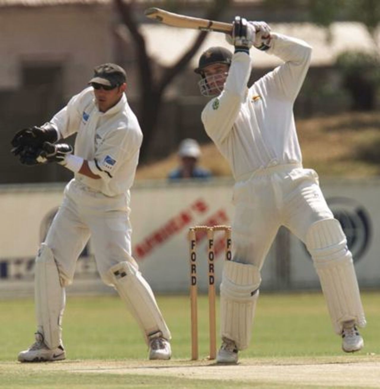 Parore looks on as Wishart plays to off-side, 1st Test Zimbabwe v New Zealand, 13 Sep 2000