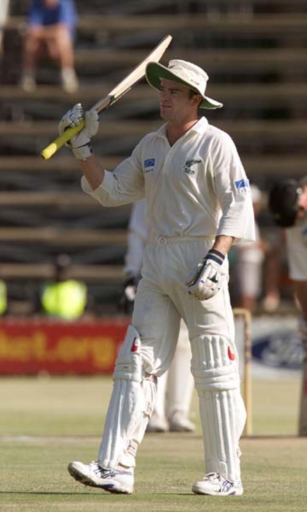 Dion Nash celebrates making his fifty in a record 8th wicket partnership with Chris Cairns