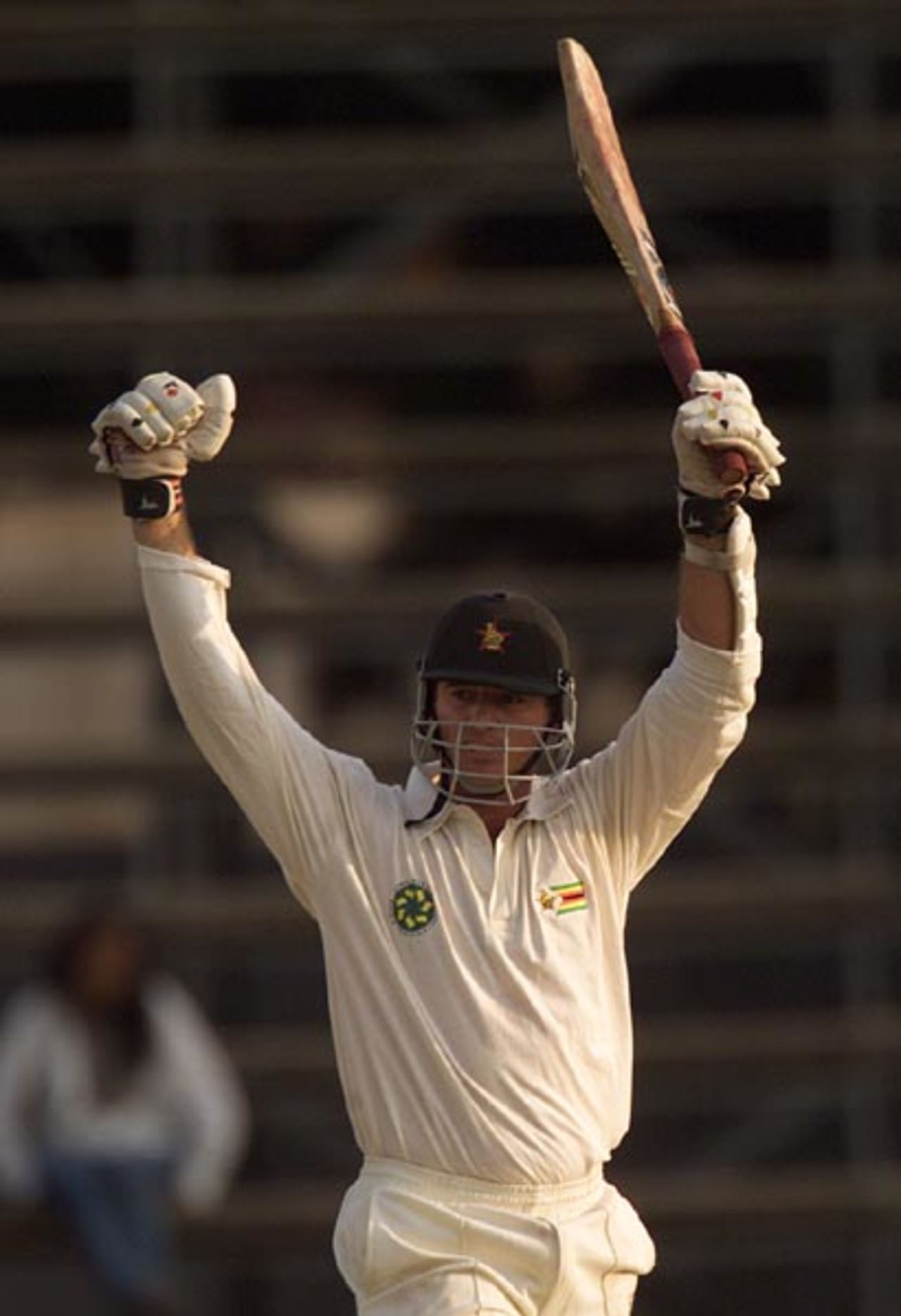 Guy Whittall celebrates his second innings century, 4th day, 2nd test, Zimbabwe v New Zealand, Sep 22 2000