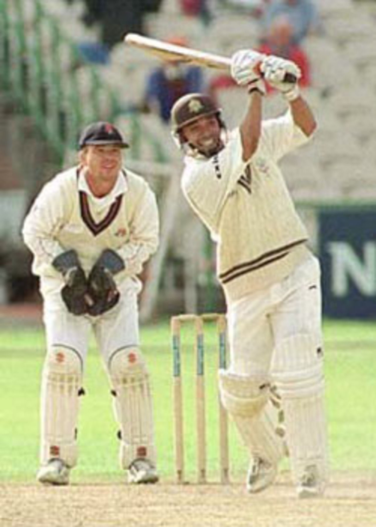 Gary Butcher hits out as warren Hegg looks on, PPP healthcare County Championship Division One, 2000, Lancashire v Surrey, Old Trafford, Manchester, 13-16 September 2000(Day 2).